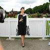 Winner of the "Best Dressed Lady" in a couture outfit- black grosgrain cocktail dress with dramatic monochrome cape
